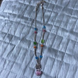 Silver with colored beads and heart charm. Very pretty 17 -18 drop inch length